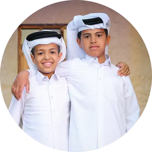 boy wearing traditional thobe for eid