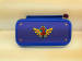 https://d2ati23fc66y9j.cloudfront.net/ubuy/75x/1/7/177208535708554NintendoSwitchOledBagZeldaDesign.jpg